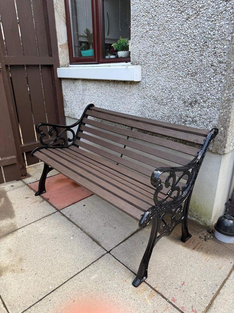 The same bench with brown slats and gloss black cast iron ends